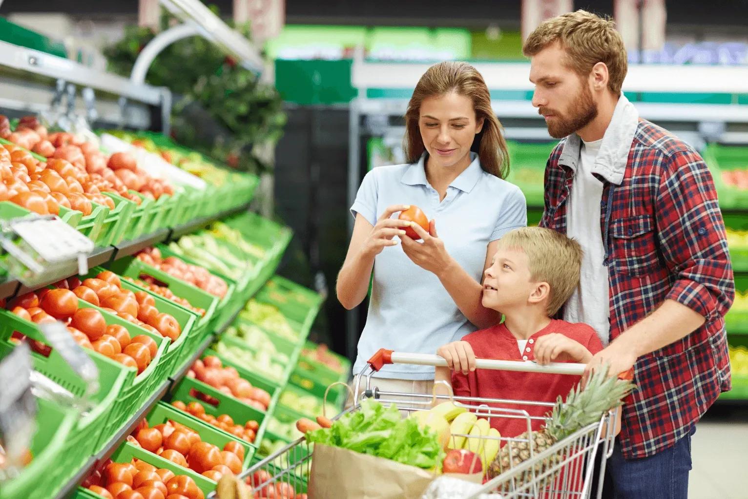 Image of a family buying vegetables at hypermarket