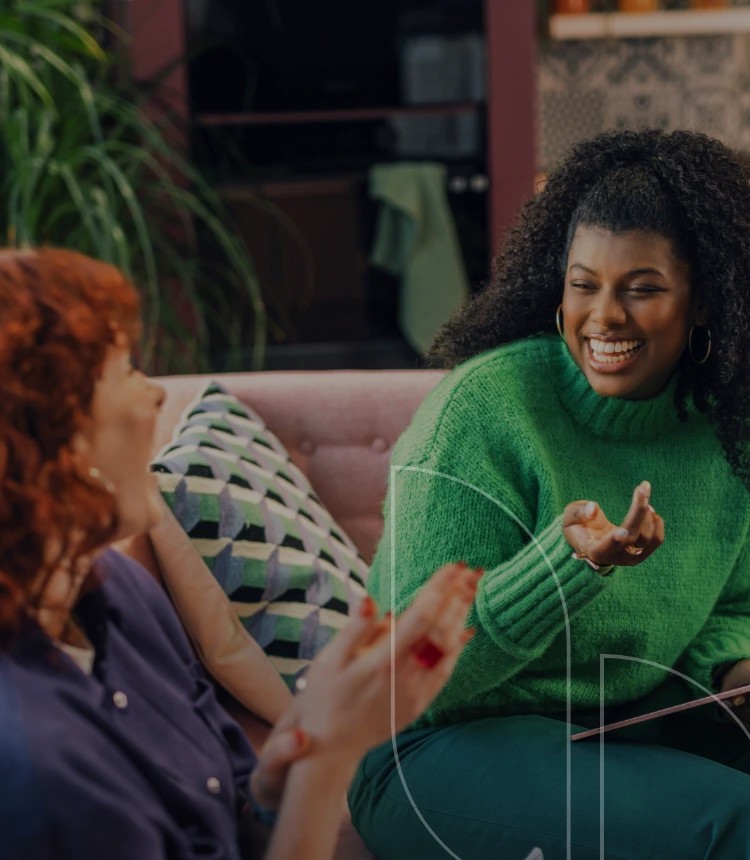 Two women engaged in conversation.